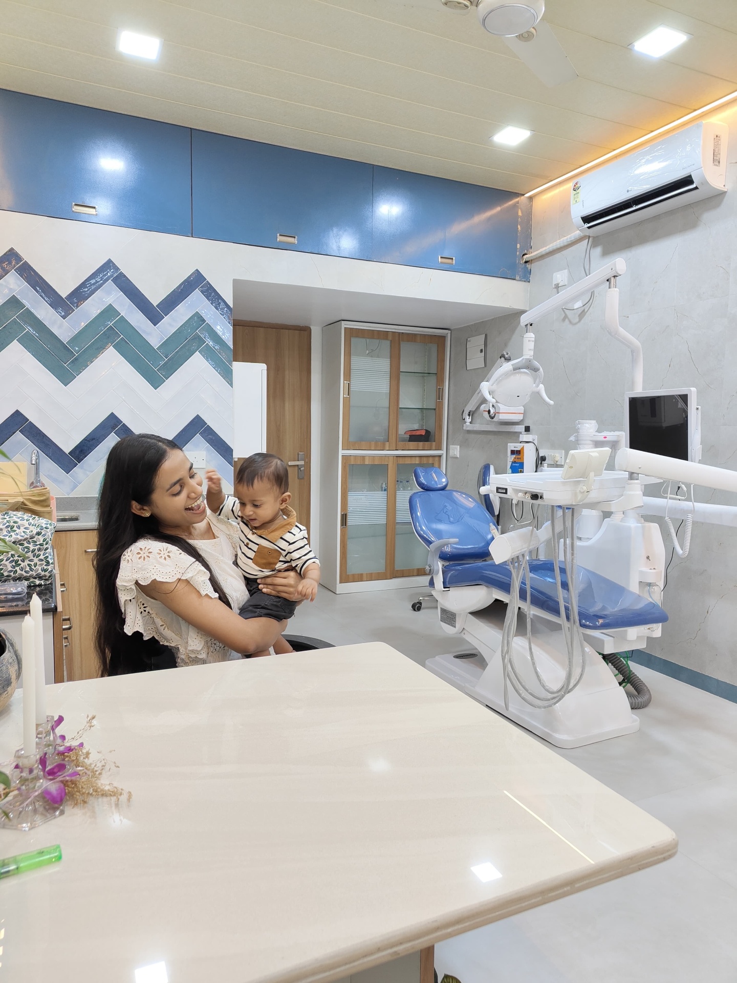 Dr. Wendy with a young patient at the clinic