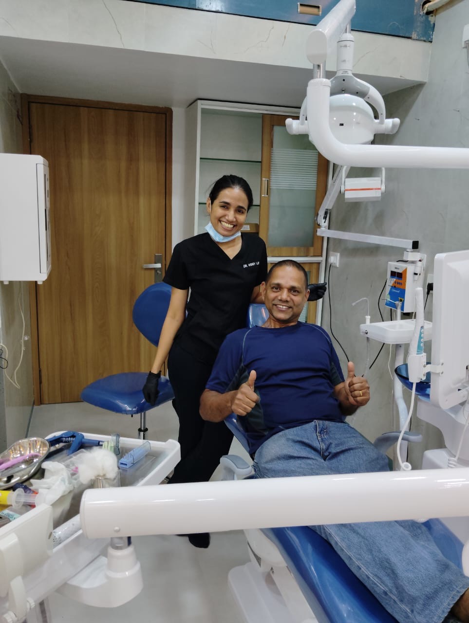 Patient giving thumbs up after treatment