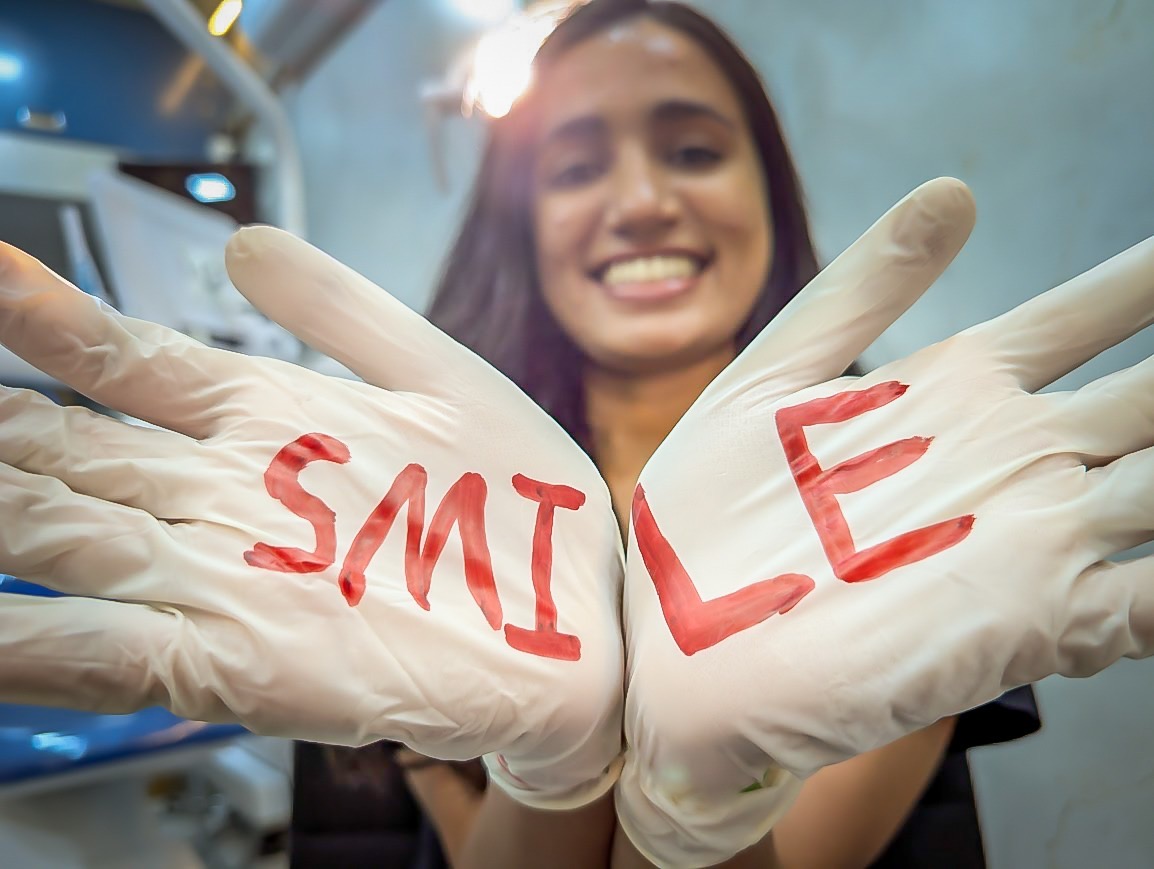 Dr. Wendy showing SMILE on gloves